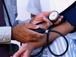 What Is Hypertension? Symptoms, Causes & Prevention Tips Checking blood pressure to detect hypertension early using a digital monitor