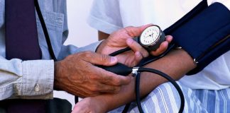 What Is Hypertension? Symptoms, Causes & Prevention Tips Checking blood pressure to detect hypertension early using a digital monitor