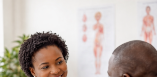 Constipation: Causes, Symptoms, Prevention, and management African doctor explaining constipation prevention to patient in clinic